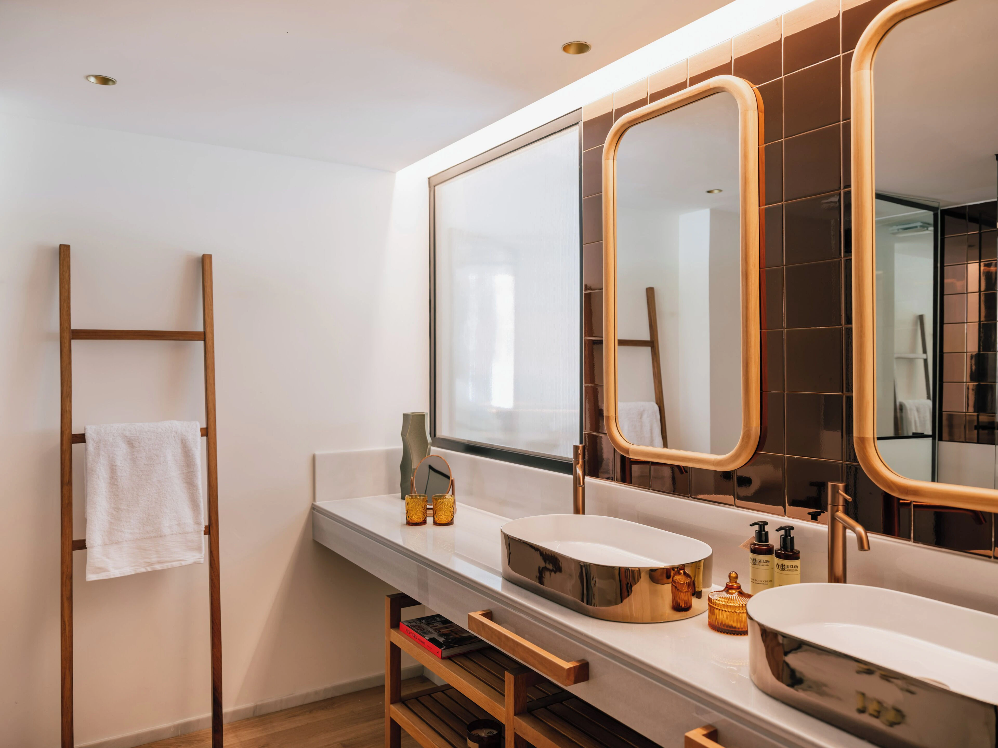ME Marbella suite bathroom with Bronze ceramic, marble and wood