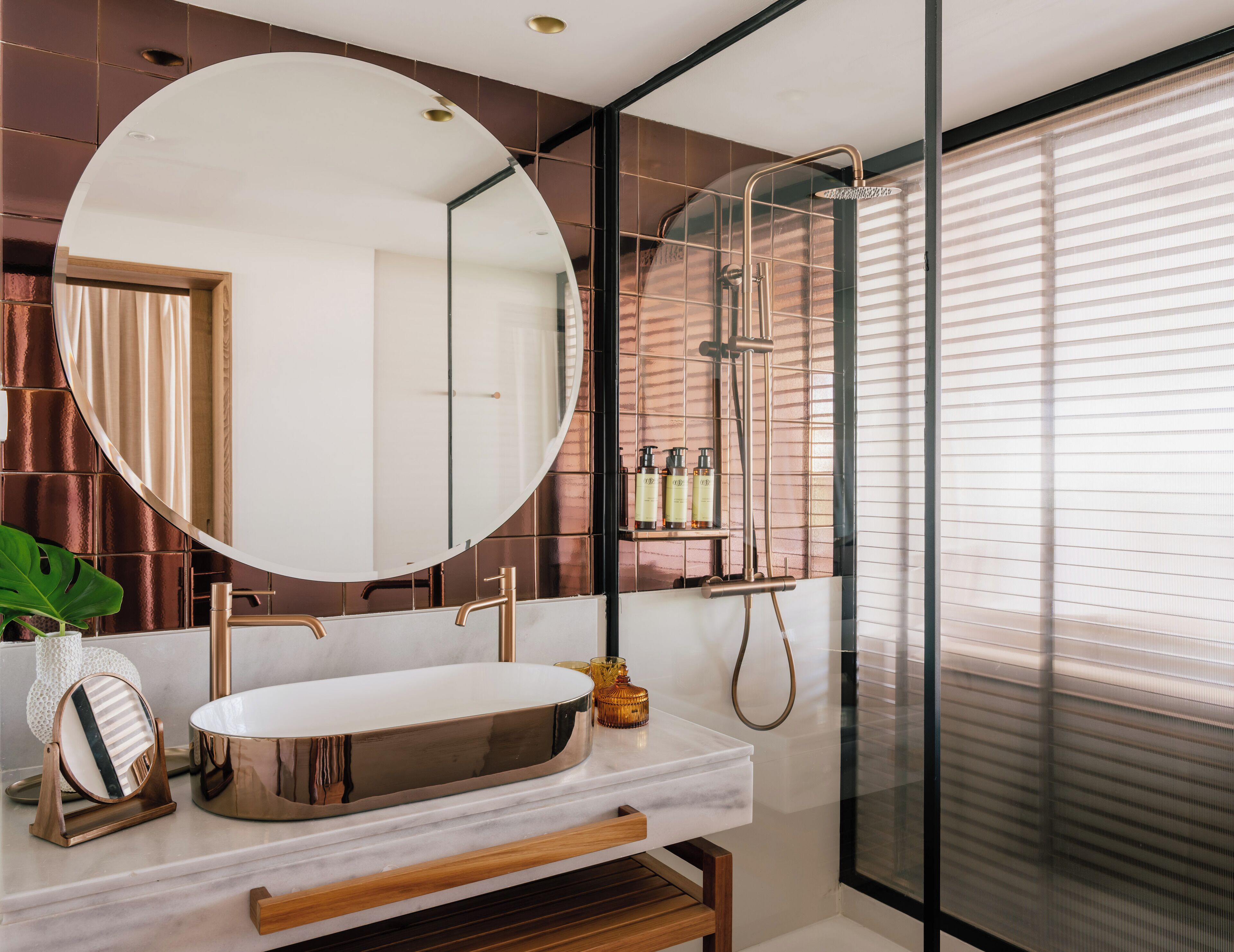ME Marbella bathroom clad in ROCED Bronze metallic tiles